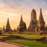 Ancient brick temples and chedis in Ayutthaya Historical Park at sunset