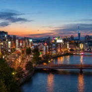 Map-style view comparing the best areas to stay in Fukuoka, including Hakata, Tenjin, Nakasu, Ohori Park and Momochi