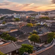 Map-style overview of the best areas to stay in Jeonju including Hanok Village, Gaeksa, Jeonju Station and Deokjin Park