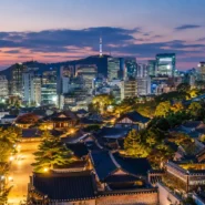 A traveler comparing the best budget hotels in Seoul by location, transport and room size