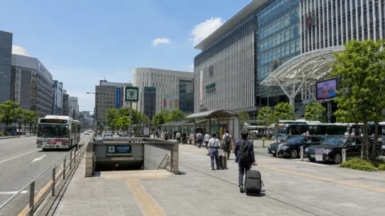 Traveler comparing subway, bus, taxi and walking routes from Hakata Station to central Fukuoka