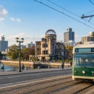 Hiroshima streetcar passing the Atomic Bomb Dome for a Hiroshima transportation guide