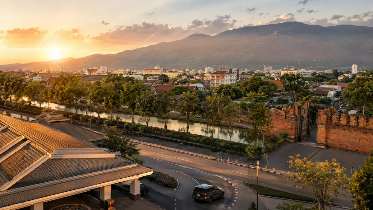 Travelers comparing transport options from Chiang Mai Airport to the city center
