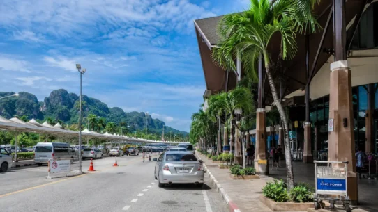Traveler choosing transport from Krabi Airport to Krabi Town city center