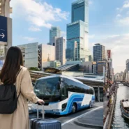Traveler comparing train, bus and private transfer options from Osaka airport to the city center