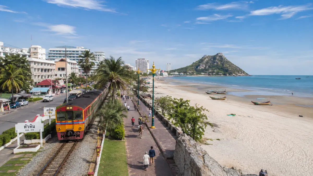 Hua Hin transportation guide showing train, green songthaew, airport coach and local travel options