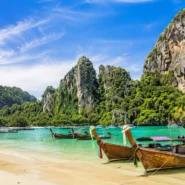 Krabi limestone cliffs, turquoise sea and longtail boats for a first-time travel guide