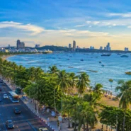 Blue songthaew baht bus on Pattaya Beach Road, Thailand