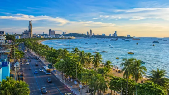 Blue songthaew baht bus on Pattaya Beach Road, Thailand