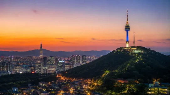 Gyeongbokgung Palace and the Seoul skyline on a three-day Seoul itinerary