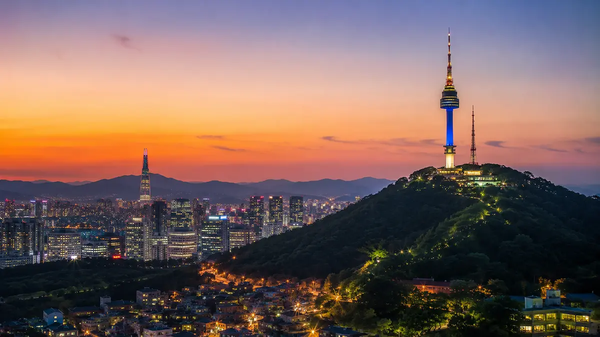 Gyeongbokgung Palace and the Seoul skyline on a three-day Seoul itinerary
