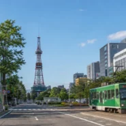 Sapporo transportation guide showing JR train, subway, streetcar and airport bus options