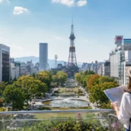Sapporo travel budget guide with Japanese yen, subway travel and a snowy city skyline