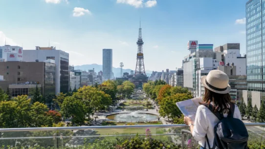 Sapporo travel budget guide with Japanese yen, subway travel and a snowy city skyline