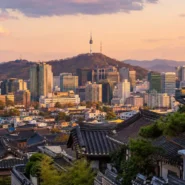 Gyeongbokgung Palace and the modern Seoul skyline for a first-time Seoul travel guide